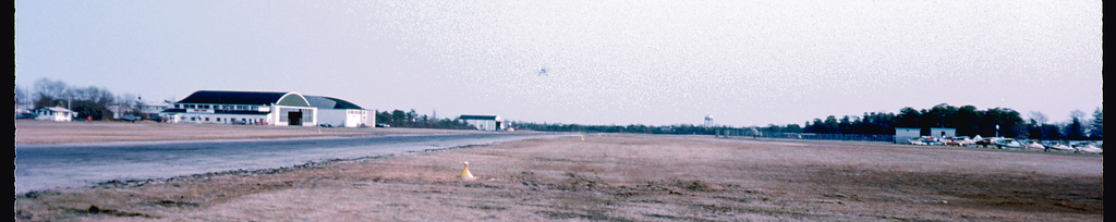 1970s-era photo of the N-S runway at Zahn's Airport. The water tower is on the horizon.